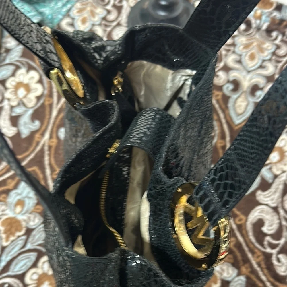 Michael Kors Black Hobo Bag with Gold Emblem